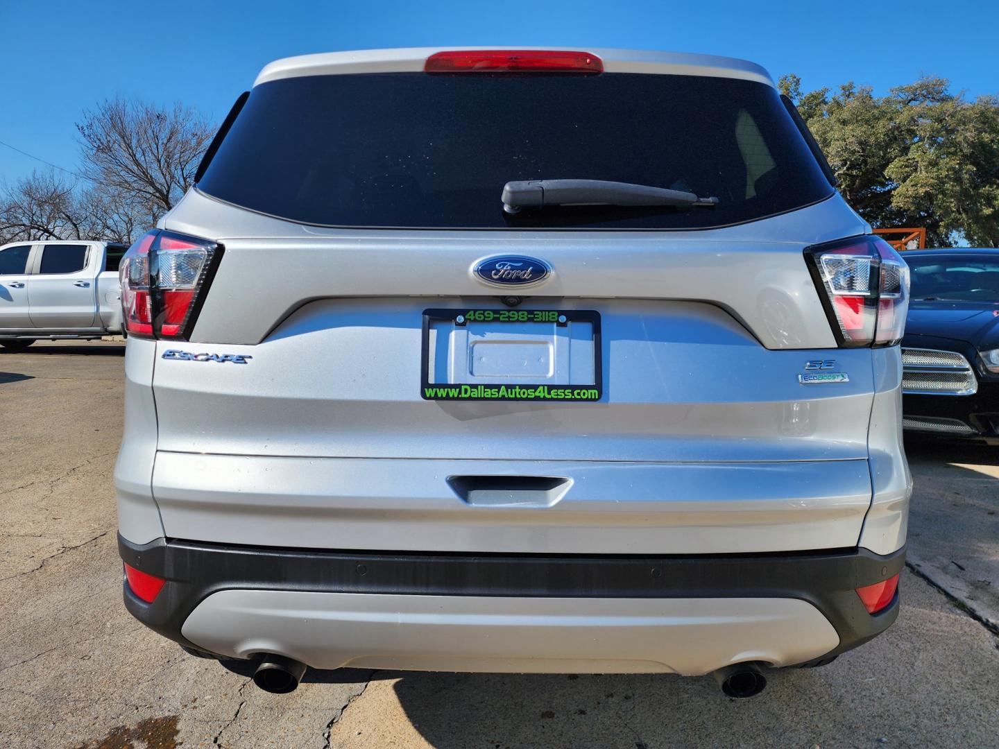 2017 SILVER Ford Escape SE (1FMCU0GD3HU) with an 1.5L L4 DOHC 16V engine, 6A transmission, located at 2660 S.Garland Avenue, Garland, TX, 75041, (469) 298-3118, 32.885551, -96.655602 - Welcome to DallasAutos4Less, one of the Premier BUY HERE PAY HERE Dealers in the North Dallas Area. We specialize in financing to people with NO CREDIT or BAD CREDIT. We need proof of income, proof of residence, and a ID. Come buy your new car from us today!! This is a Super Clean 2017 FORD ESCAP - Photo#4